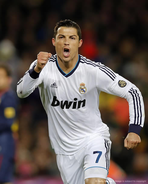 Cristiano Ronaldo brings his fist forward to show his joy after scoring for Real Madrid against Barcelona, in the Clasico for the Copa del Rey semi-finals, in 2013