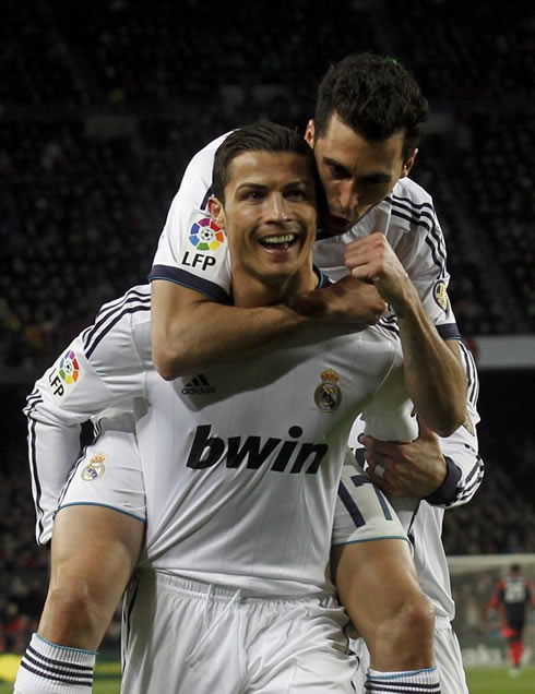 Cristiano Ronaldo and Arbeloa celebrating Real Madrid away goal against Barcelona, in a packed Camp Nou stadium