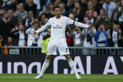 Cristiano Ronaldo with his arms wide open, celebrating Real Madrid goal at the Bernabéu