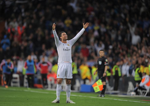 Real Madrid raising his two arms and smiling in front of the Santiago Bernabéu audience