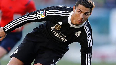 Cristiano Ronaldo trying to keep his balance during a La Liga match between Celta de Vigo and Real Madrid