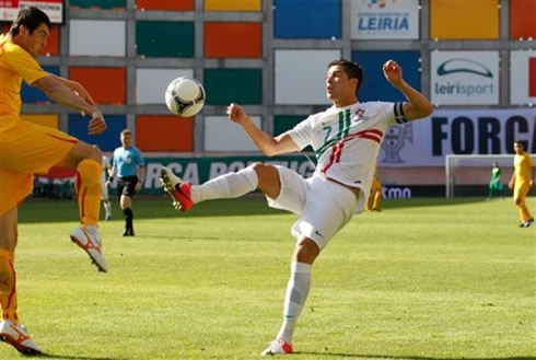 Cristiano challenging a defender for a loose ball, in a friendly match between Portugal and Macedonia, in 2012