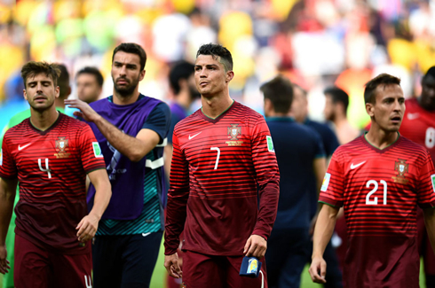Miguel Veloso, Cristiano Ronaldo and João Pereira walk away from the pitch after Portugal's goodbye to the 2014 FIFA World Cup