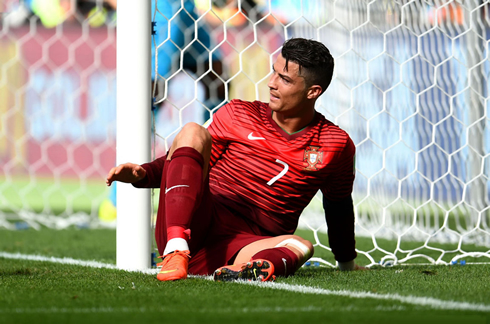 Cristiano Ronaldo lays down on the ground, in a Portugal match at the FIFA World Cup 2014