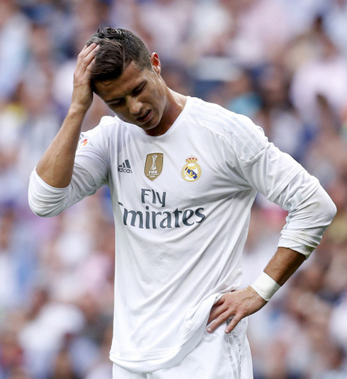 Cristiano Ronaldo holding his head in pain