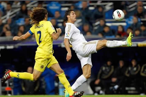 Cristiano Ronaldo shows his flexibility as he stretches his leg to touch the ball against Villarreal