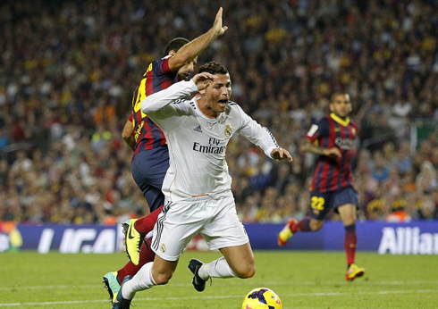 Cristiano Ronaldo being fouled for a penalty-kick by Mascherano in the Clasico between Barcelona and Real Madrid, in La Liga 2013-2014