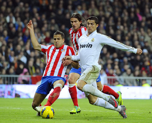 Cristiano Ronaldo losing the ball to a defender