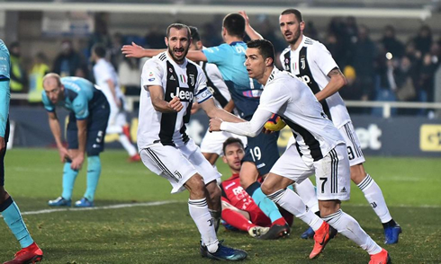 Cristiano Ronaldo picks up the ball and runs back to resume the game as soon as possible