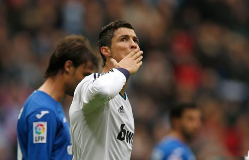 Cristiano Ronaldo sending kisses to his mother and son, present at the Santiago Bernabeu stands, in a morning game for La Liga 2013
