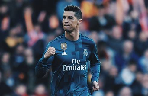 Cristiano Ronaldo with a black eye, biting his tongue after scoring for Real Madrid