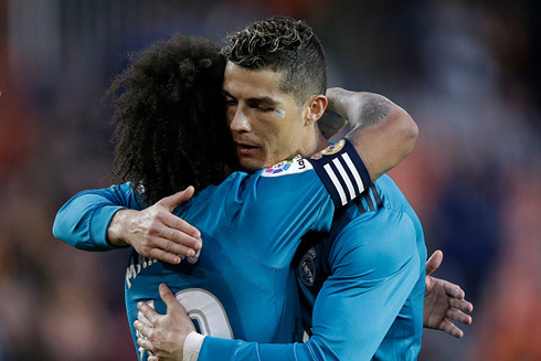 Marcelo and Cristiano Ronaldo hugging each other in Real Madrid in 2018