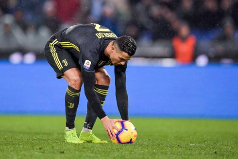 Cristiano Ronaldo places the ball before taking a penalty-kick