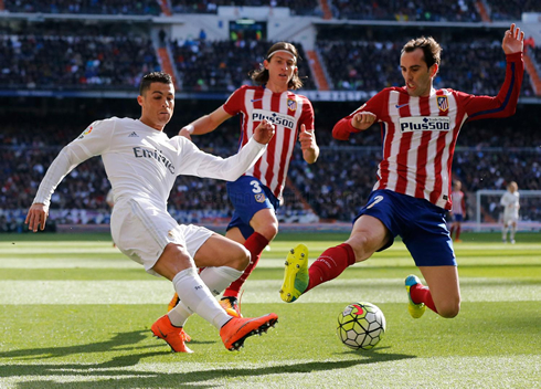 Cristiano Ronaldo and Diego Godín both going all-in for a loose ball