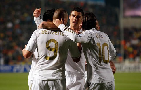 Cristiano Ronaldo with Karim Benzema and Mesut Ozil, celebrating goal for Real Madrid in 2012