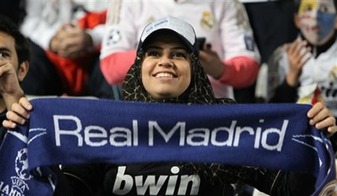 A Real Madrid female fan from the mideast, wearing burka