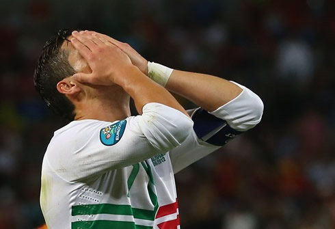 Cristiano Ronaldo covering his face with his hands and crying, after Portugal lost against Spain in the EURO 2012 semi-finals penalty-kicks