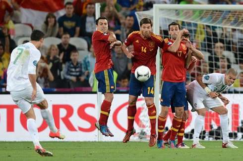 Cristiano Ronaldo free-kick in Portugal vs Spain, about hit the wall being formed by Xavi, Xabi Alonso and Arbeloa, in the EURO 2012