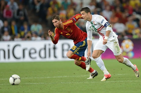 Cristiano Ronaldo running away from Sergio Ramos, in Portugal vs Spain for the EURO 2012 semi-finals