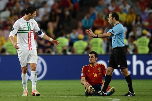 Cristiano Ronaldo complaining about Sergio Busquets being always on the ground faking injuries, in Portugal vs Spain at the EURO 2012 semi-finals