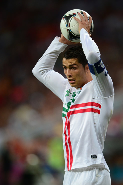 Cristiano Ronaldo holding the ball as he prepares to make a free-throw in Portugal vs Spain for the EURO 2012