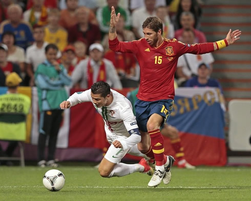 Cristiano Ronaldo being fouled by Sergio Ramos, in Portugal vs Spain at the EURO 2012