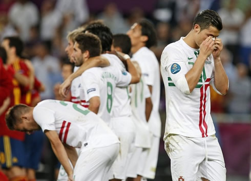 Cristiano Ronaldo crying and away from his teammates, as Portugal gets eliminated by Spain in the EURO 2012 semi-finals penalty shootout decision