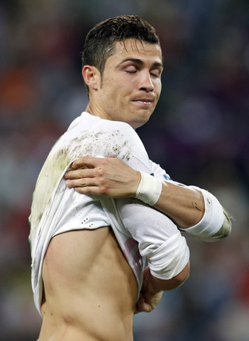 Cristiano Ronaldo taking his shirt off, to show his injury, in Portugal vs Spain at the EURO 2012 semi-finals