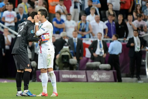 Cristiano Ronaldo telling a secret to the Portuguese goalkeeper, Rui Patrício, in the game between Portugal and Spain for the EURO 2012