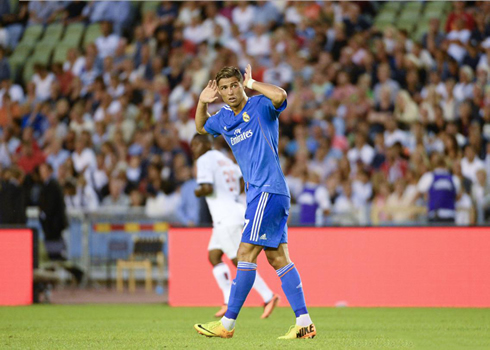 Cristiano Ronaldo making the free-throw gesture, in a Real Madrid game where he wore the new blue kit for 2013-2014