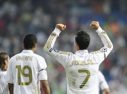 Cristiano Ronaldo raising his hands to his teammates, celebrating his goal