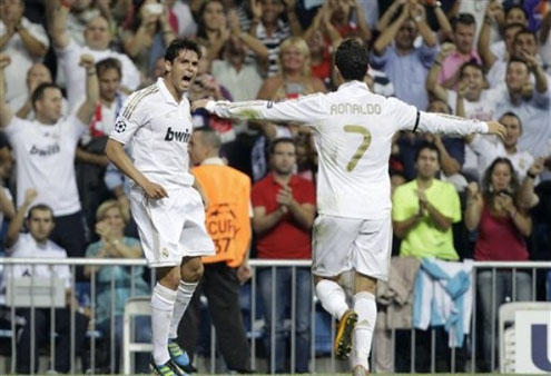 Cristiano Ronaldo running towards Kaká with arms wide open to celebrate their goal in 2011/12