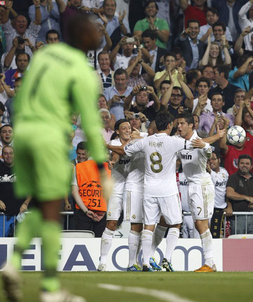 Cristiano Ronaldo in a group hug with his Real Madrid teammates in 2011-2012 against Ajax