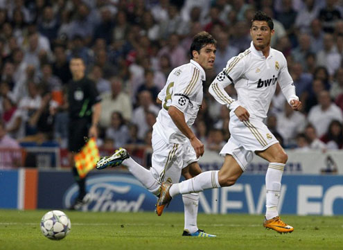 Cristiano Ronaldo in motion, with Kaká running behind him