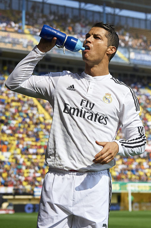 Cristiano Ronaldo drinking from the bottle
