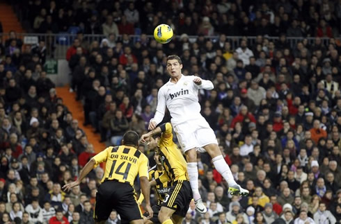 Cristiano Ronaldo rising above Zaragoza defenders to head the ball