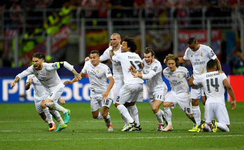 Real Madrid players reacting to Cristiano Ronaldo's winning penalty-kick in the 2016 Champions League final