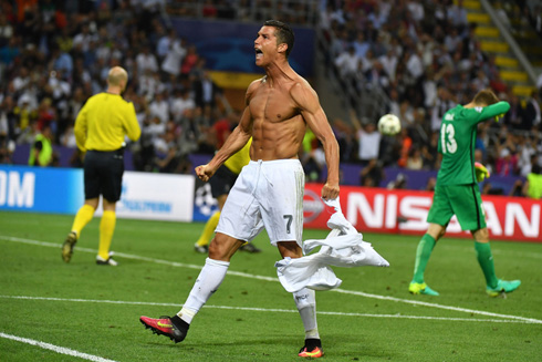Cristiano Ronaldo showing off his ripped body and muscles after scoring the decisive penalty in the Champions League 2016