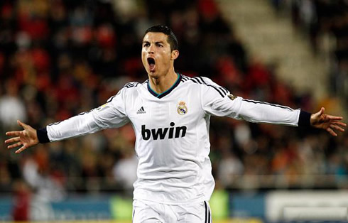 Cristiano Ronaldo with his mouth open as he runs with his arms wide open, in Real Madrid 2012-2013