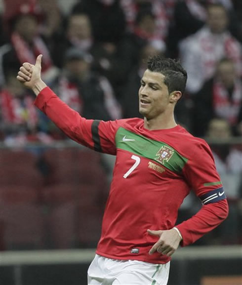 Cristiano Ronaldo showing his thumbs up to his teammate, in a match between Poland and Portugal