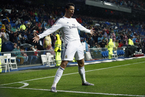 Cristiano Ronaldo with his legs and arms open, as he celebrates a goal for Real Madrid