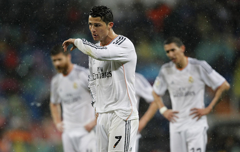 Cristiano Ronaldo wiping his face to his slieve, during a rainy gameday in Madrid