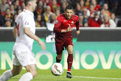 Cristiano Ronaldo with his eyes locked on the ball, in Portugal vs Serbia