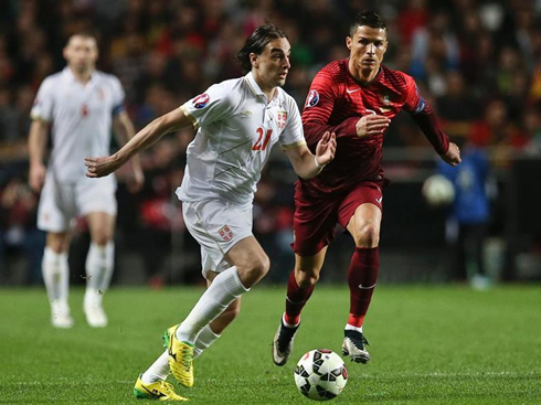 Cristiano Ronaldo chasing Markovic, in Portugal vs Serbia at the Estádio da Luz