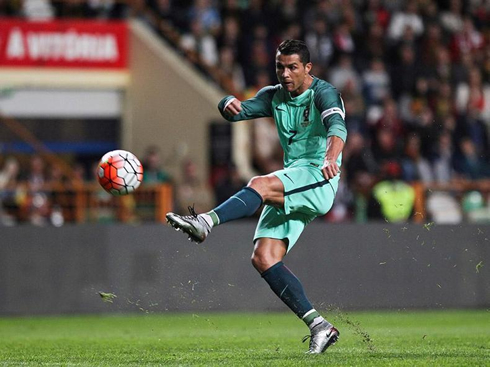 Cristiano Ronaldo strikes the ball with his left foot, in Portugal 2-1 Belgium