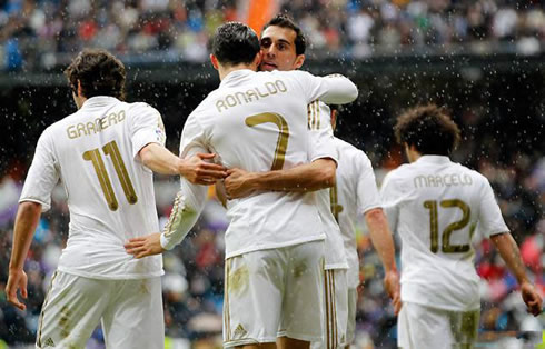 Cristiano Ronaldo hugging Alvaro Arbeloa, while Granero walks away in Real Madrid goal celebrations in 2012