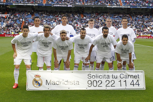 Real Madrid players wearing a supportive 'Todos con Nepal' shirt before their game against Almeria