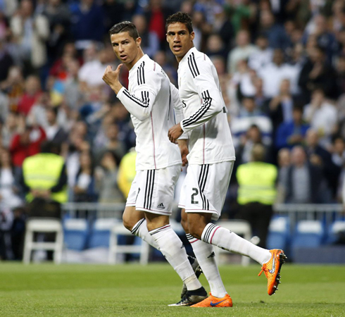 Cristiano Ronaldo and Raphael Varane heading back to their side's half