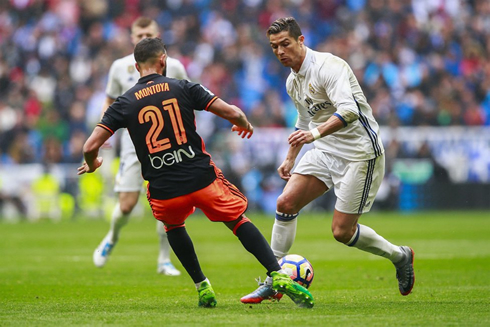 Cristiano Ronaldo takes on a Valencia player in a clash for La Liga in April of 2017