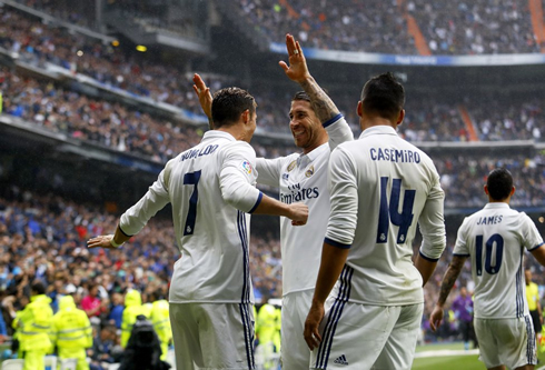 Cristiano Ronaldo celebrates with Sergio Ramos and Casemiro